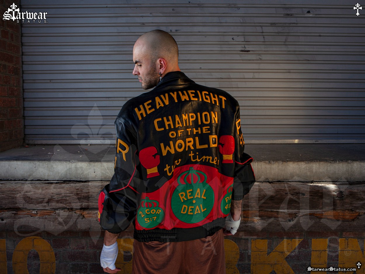 Model Jadius Knight wearing the Evander "Real Deal" Holyfield Worn & Owned Leather Jacket featuring boxing gloves design from the unrivalled Starwear Status fashion archive — an ultra-rare piece of sports memorabilia once owned by the two-time heavyweight champion Evander Holyfield.