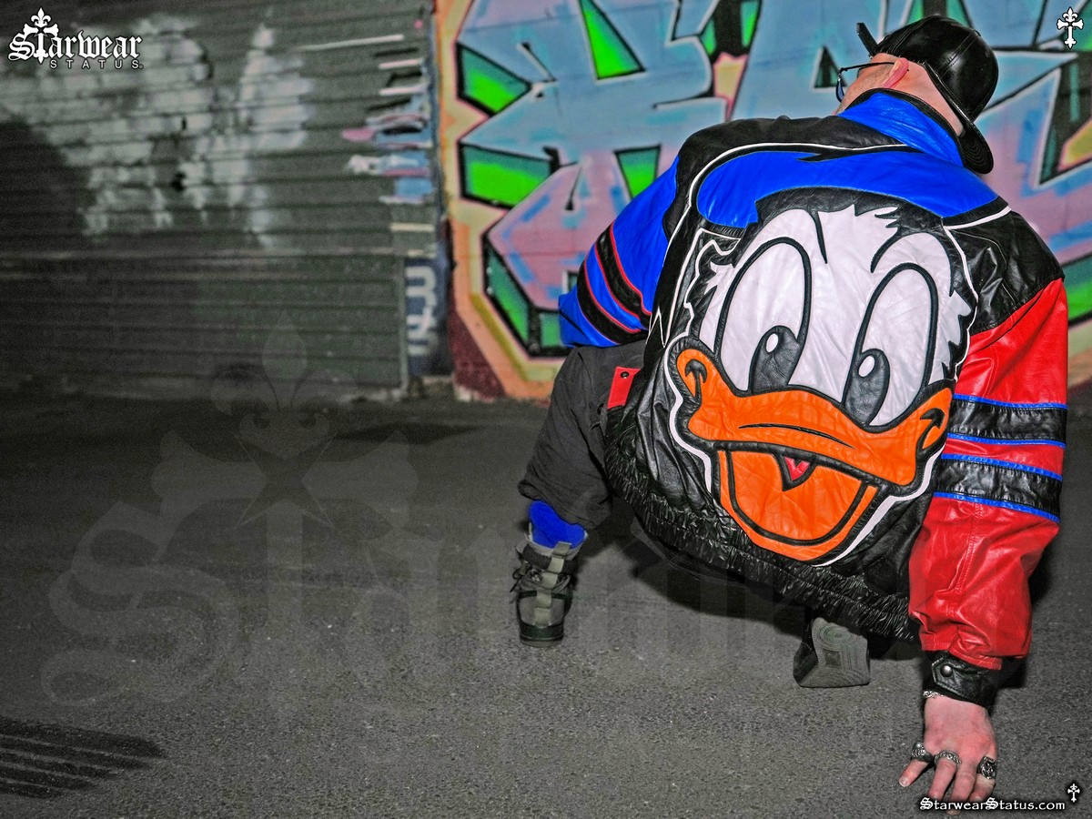 Jadius Knight wearing Vintage 80s–90s Walt Disney’s Donald Duck cartoon leather bomber jacket by Mickey & Co featuring oversized Donald Duck back graphic from the unrivalled Starwear Status fashion archive